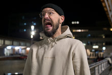 Load image into Gallery viewer, Stefan Kuhnigk wearing the thecoffeemonsters "19 "Angry Chicken" crema standard hoodie" at night in a carpark, screaming for fun.